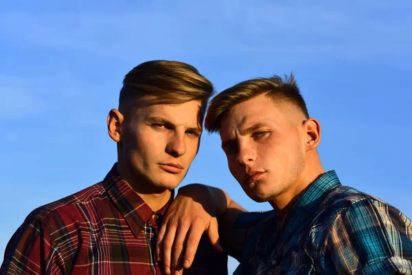 Caucasian twins in shirts with serious faces — Stock Photo, Image