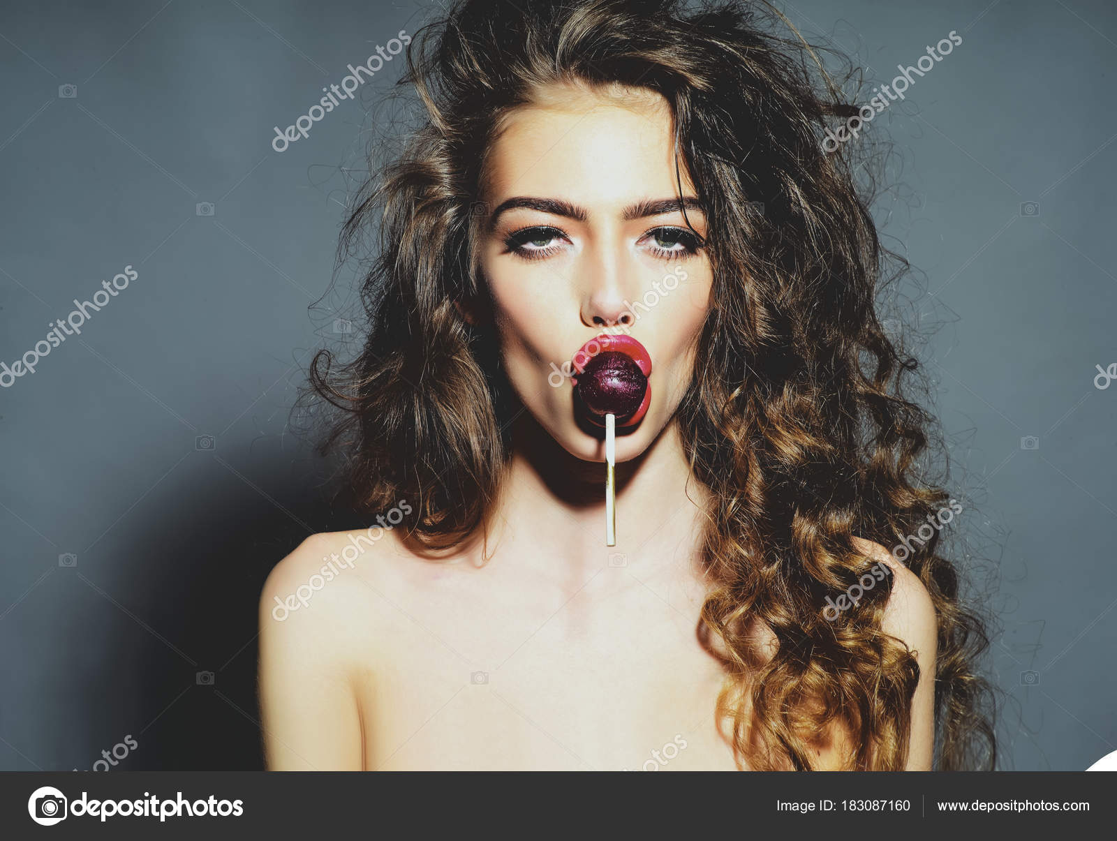 Sexy woman with lollipop in sensual mouth Stock Photo by ©Tverdohlib 183087160 image