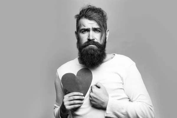 sad man with paper heart