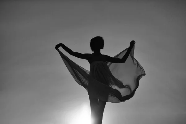 Silhouette of girl over sunset — Stock Photo, Image