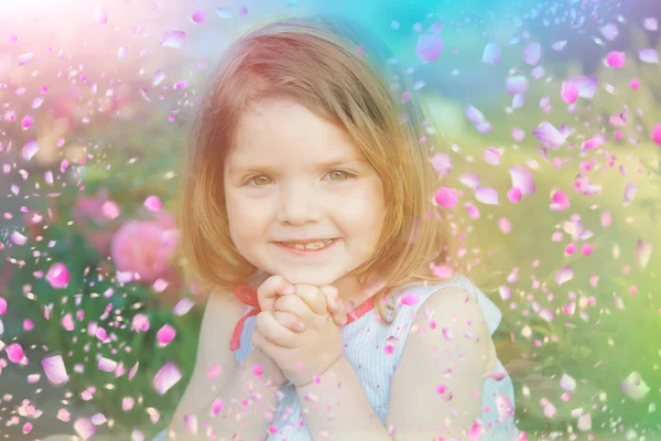 Happy child. Kid in flowers — Stock Photo, Image