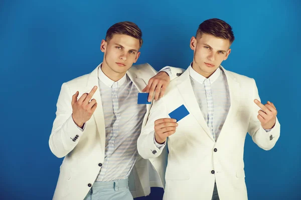 Businessmen showing middle fingers in white jackets — Stock Photo, Image