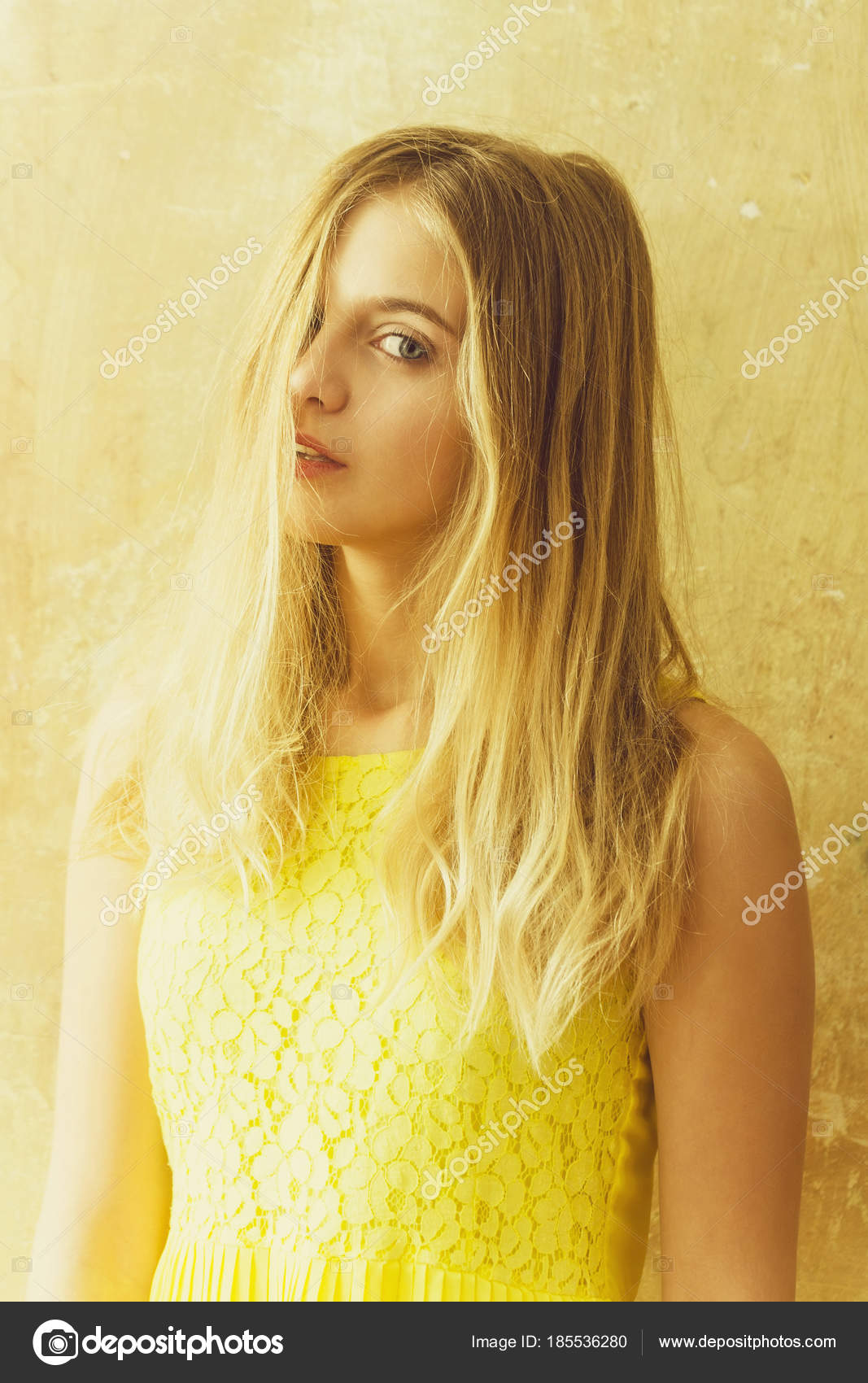 Pretty Happy Girl With Long Blonde Hair In Yellow Dress Stock