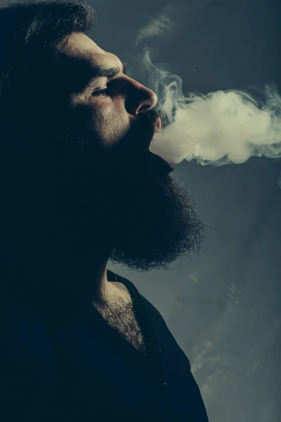 Bearded man with smoke — Stock Photo, Image