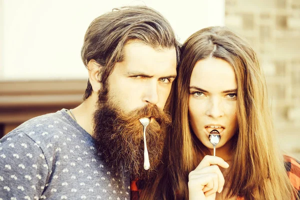 Young couple with tea spoon — Stock Photo, Image