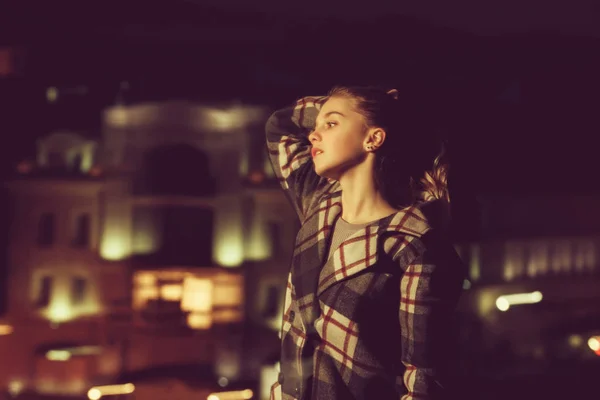 City and night with girl, blonde model in checkered coat — Stock Photo, Image