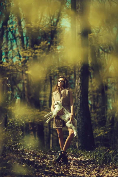 Young girl with goat in forest — Stock Photo, Image