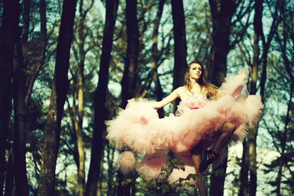 Glamour girl dancing in forest — Stock Photo, Image