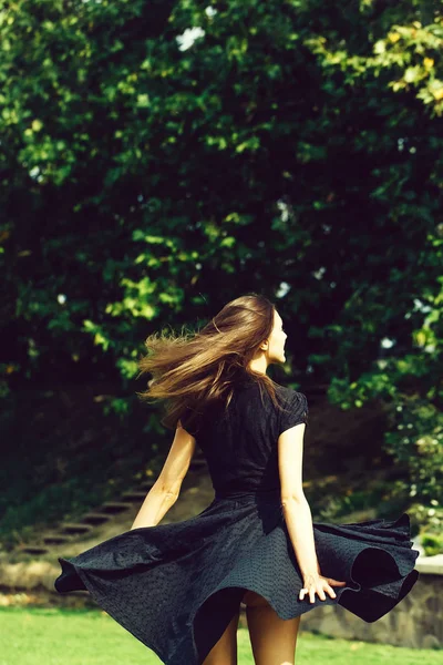 Attractive young girl with spinning dress