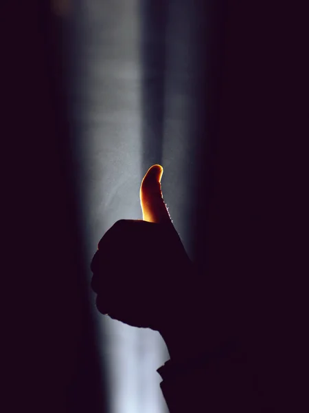 Hand gesture in spotlight — Stock Photo, Image