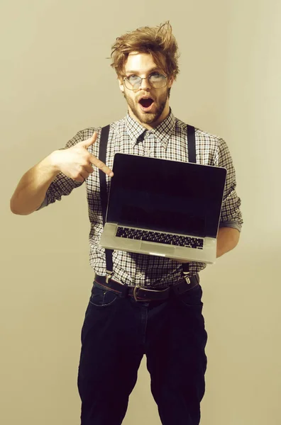 Surprised man or student with open mouth and laptop