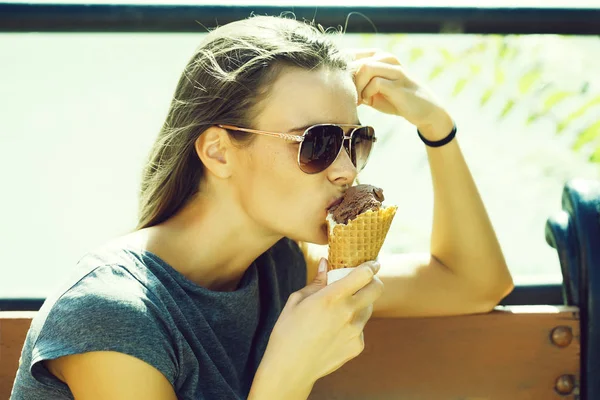 Young woman eating ice cream