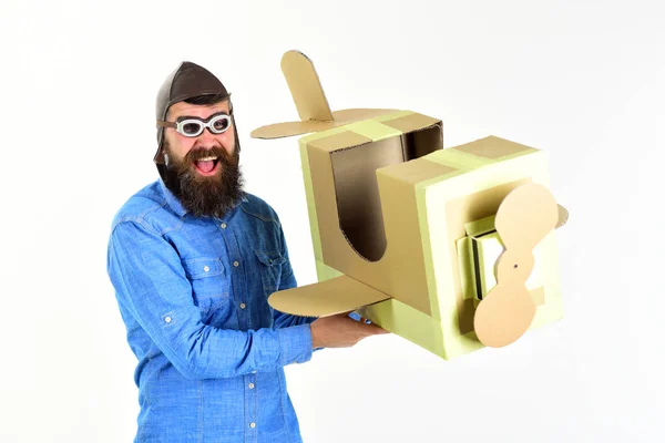Bearded man father hold cardboard plane isolated on white. — Stock Photo, Image