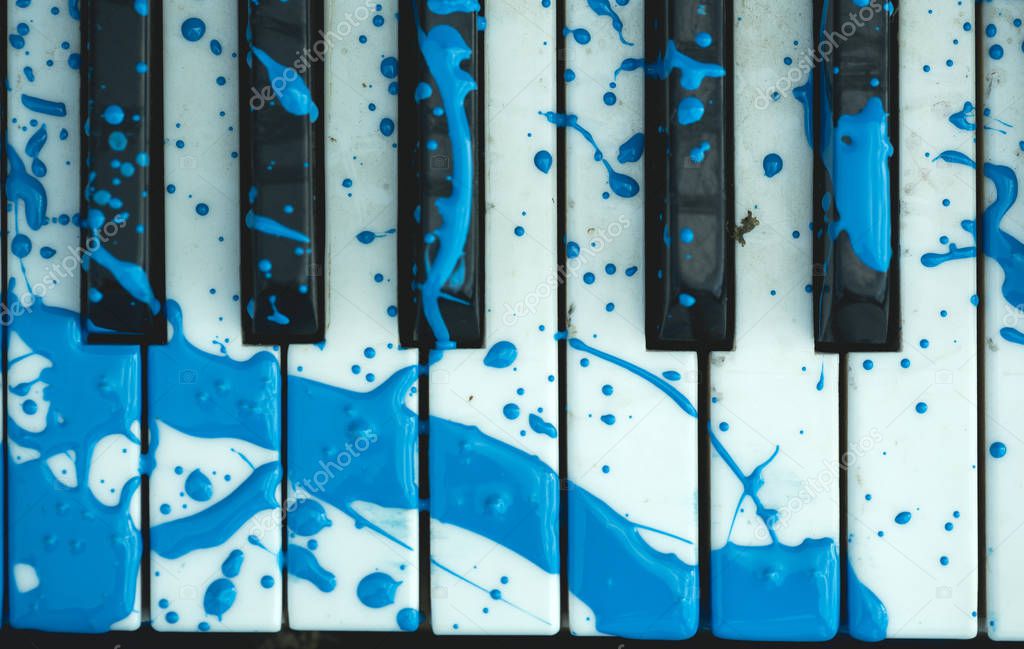 piano keyboard with a painted stain