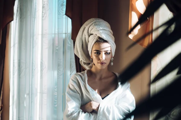 Girl with towel on head relaxing, after spa — Stock Photo, Image