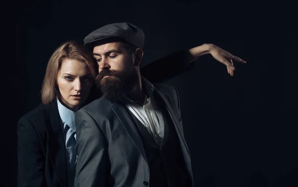 Man and woman in retro suit and hat
