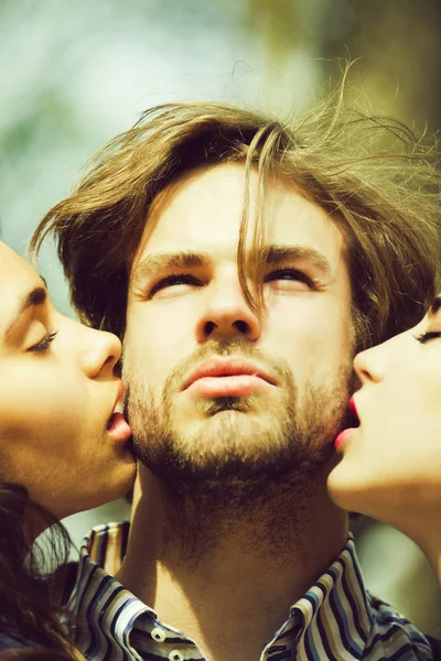 People, man getting kiss by two adorable girls — Stock Photo, Image
