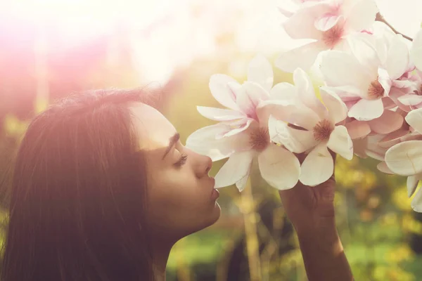 Magnolia flowers and woman or pretty girl. Spring — Stock Photo, Image