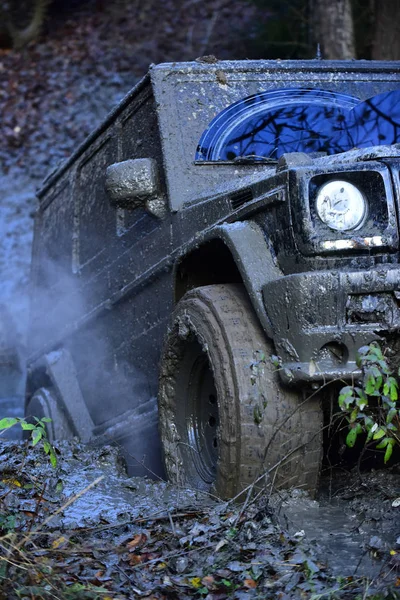 Part of car stuck in dirt, close up. Dirty tire — Stock Photo, Image