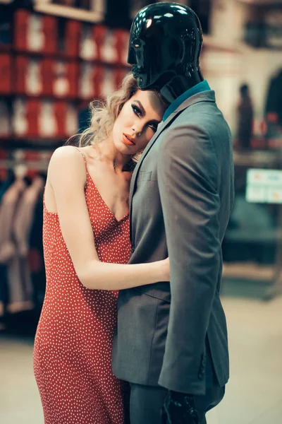 Girl with male mannequin in clothing shop, shopping — Stock Photo, Image