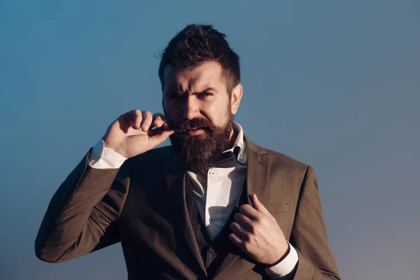 Man with beard and mustache with dramatic sky on background — Stock Photo, Image