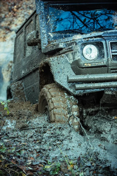Impassibility of roads concept. Dirty offroad tire covered with mud. — Stock Photo, Image