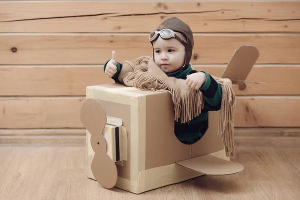 cardboard plane, childhood, little boy pilot.