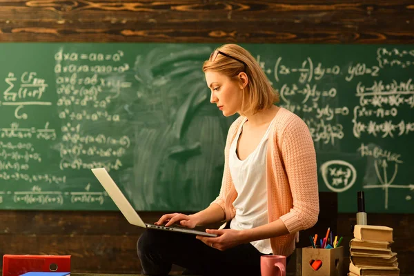 Teacher in glasses reading reports of talented students correcting mistakes, Tutor needs to be enthusiastic and needs to like his subject, Student studying online courses with computer,