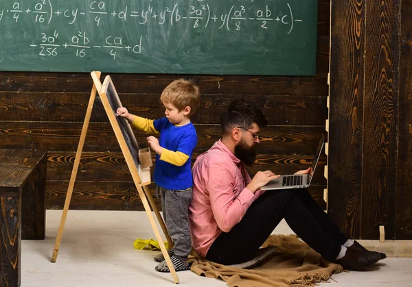 Tutor should believe that things can be changed through action. Good teachers seek engaged students. happy child is learning. Modern teacher hipster writing on big blackboard with math formula.