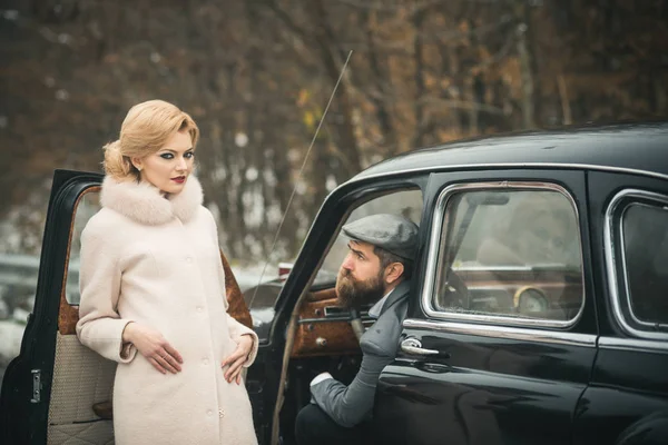 meeting of woman in fur coat and bearded man. meeting and date of couple in love.