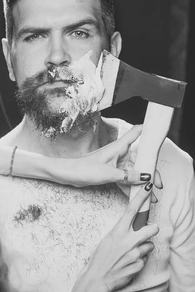 Bearded man having shaved