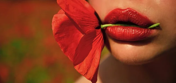 Woman with poppy flower in red lips, makeup. — Stock Photo, Image