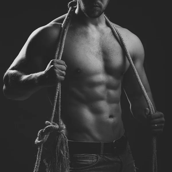 Muscular man with rope — Stock Photo, Image