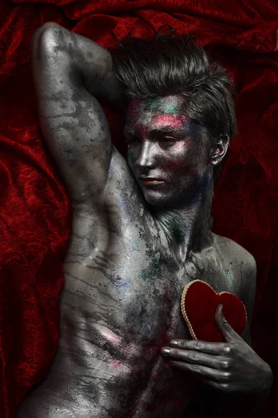 A Man Covered with Shimmering Body Paint · Free Stock Photo