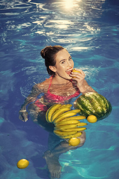 Vitamin in fruit at girl near water. vitamin and healthy organic food.