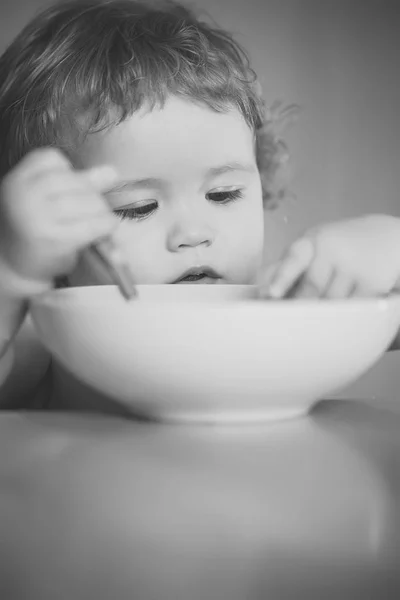 Portrait of beautiful boy eating — Stock Photo, Image