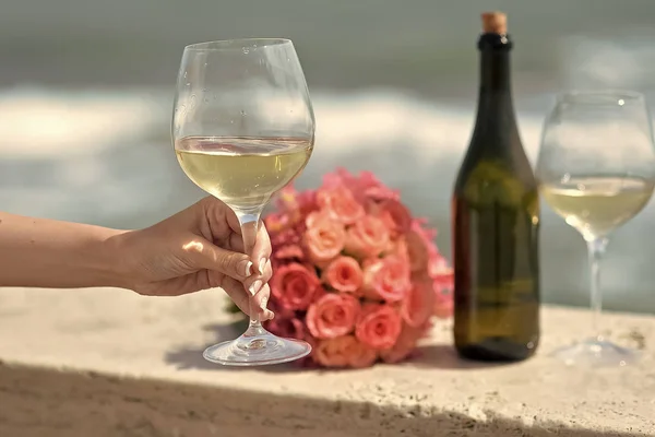 Wedding bouquet bottle and wine glasses