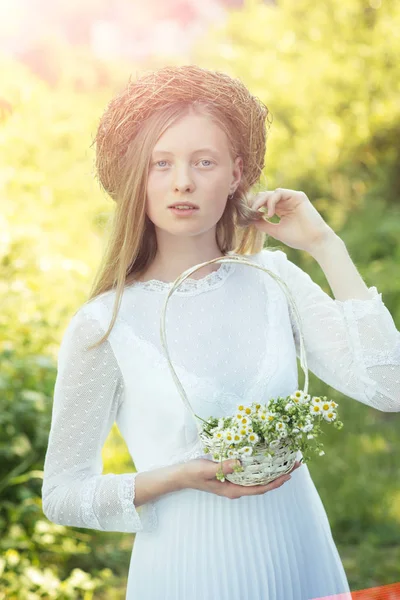 Woman bride in white wedding dress. Sensual woman in wreath on long blond hair. Albino girl with camomile daisy flowers, natural beauty. Fashion model at sunny outdoor on vacation — Stock Photo, Image