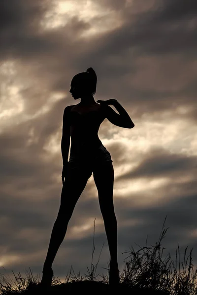 Female silhouette and sky