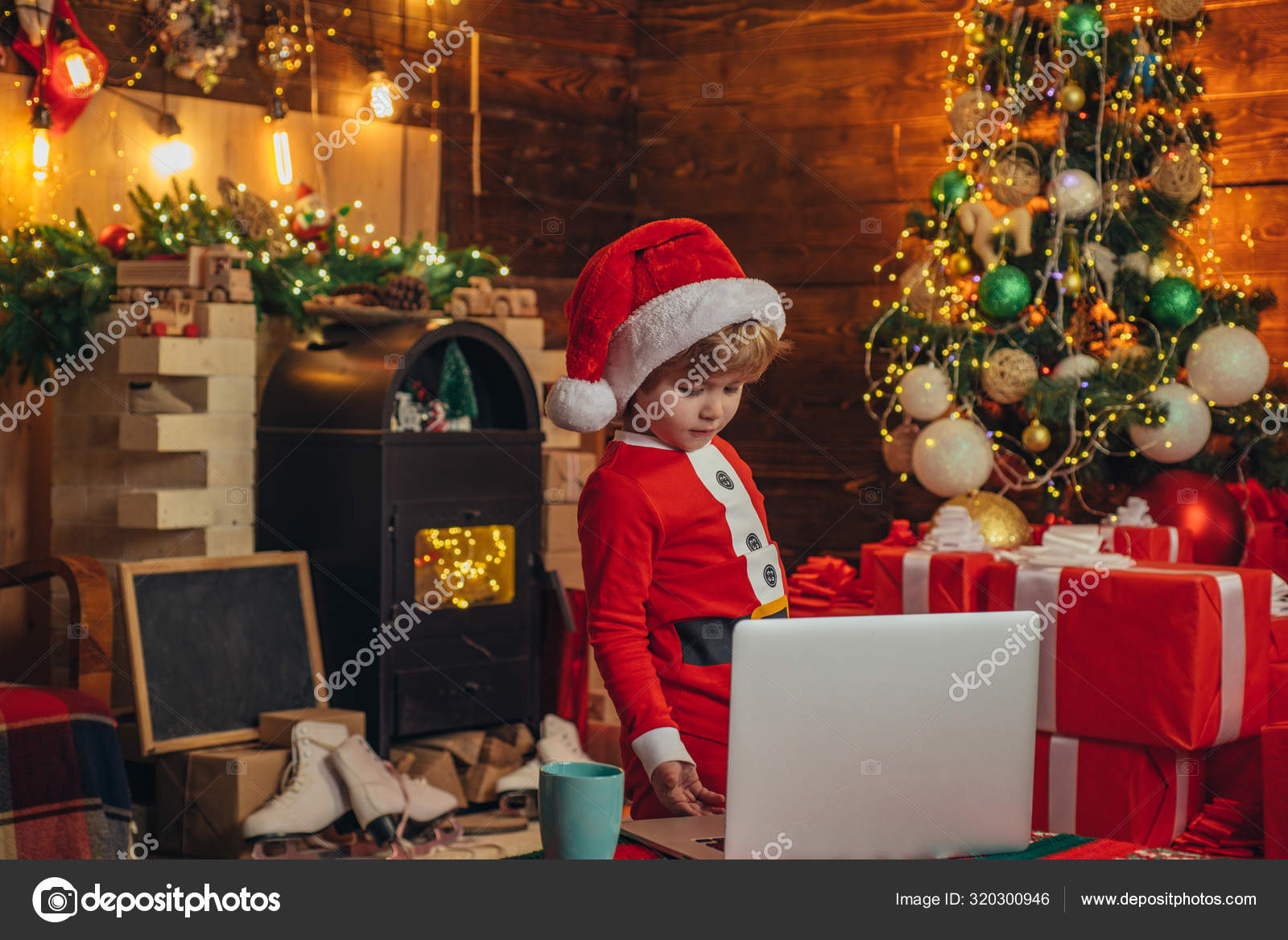 Smart Toddler Surfing Internet Santa Little Helper Little Boy Santa Hat And Costume Boy Child With Laptop Near Christmas Tree Buy Christmas Gifts Online Christmas Shopping Concept Gifts Service Stock Photo
