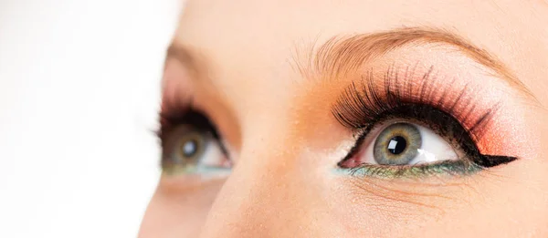 Close up eyes of a woman. The pupil and iris of the eye close-up. Pin up style. Closeup grey eye with bright makeup. Macro shot with perfect skin. — Stock Photo, Image