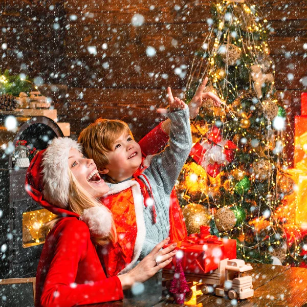 Mother and little child boy adorable friendly family having fun. Family having fun at home christmas tree. Mom and kid play together christmas eve. Happy family. Family holiday. Santa claus coming — Stock Photo, Image