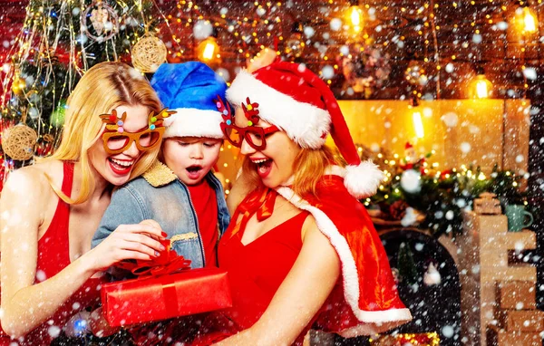 Christmas family is opening gifts. Christmas party mood. Happy family. — Stock Photo, Image