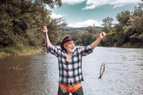 Elegant bearded man fishing. Catching and fishing. Hunting. Perfect weekend. Just do that only. Fishing freshwater lake pond river. It is not sport it is obsession. Hobby sport activity. — Stock Photo, Image