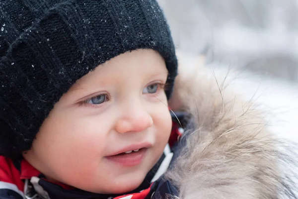 Closeup portrait of happy child in winter hat. Funny happy cute little boy in winter park. Snowy cold weather. Amazing winter park. Beautiful winter nature. — 스톡 사진