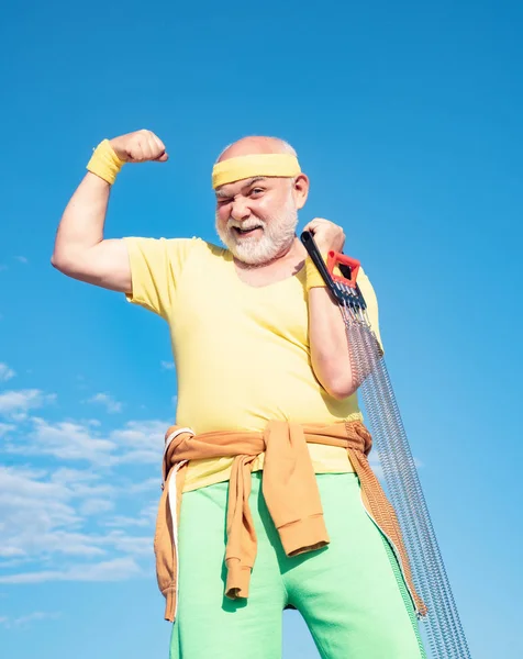 Like sports. Senior sportsman in sport center. Sporting. Grandfather sportsman. Grandfather sportsman on blue sky backgrounds.