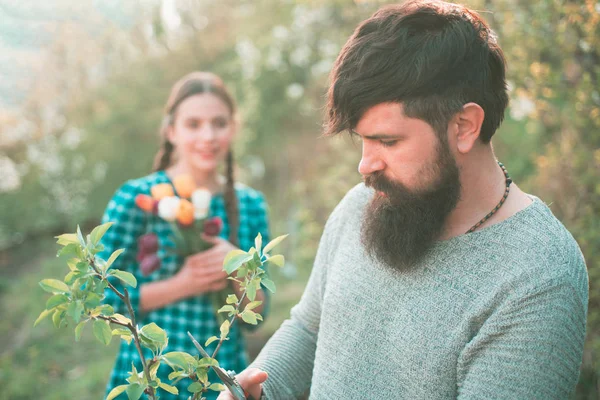 Farming and agriculture cultivation. Crop planting at fields. Become organic farmer. Portrait of wife and husband while working in garden. Grafting branch. — Stock Photo, Image