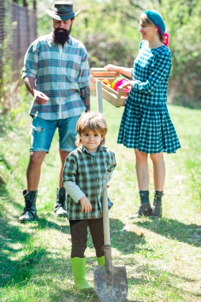 Happy family in garden. Family work in South America with livestock in family country ranch. Father mother and little kid boys having fun on farm in spring. — 스톡 사진