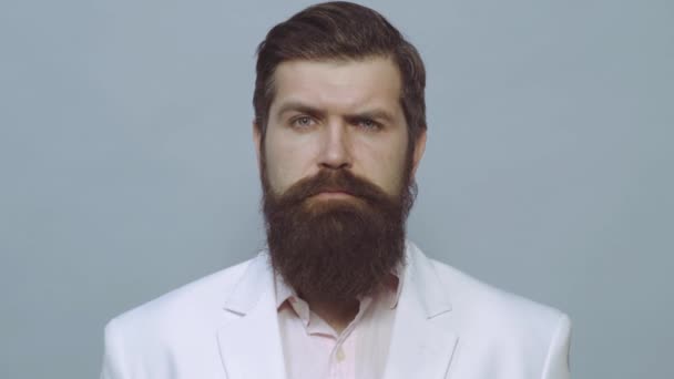 Serious face. Portrait Handsome Business man with confident face. Portrait of satisfied businessman against grey wall. — Stock Video