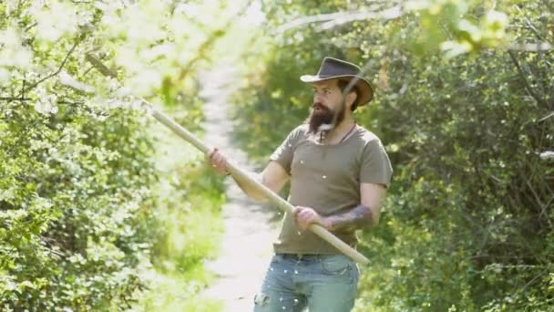 Man with beard - farm worker. Eco farm worker. Farming and agriculture cultivation. Country life. Retro advertising of alcoholic beverages. Man hold shovel. — Stock Video